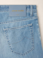 Men's light blue straight leg jeans with five-pocket styling