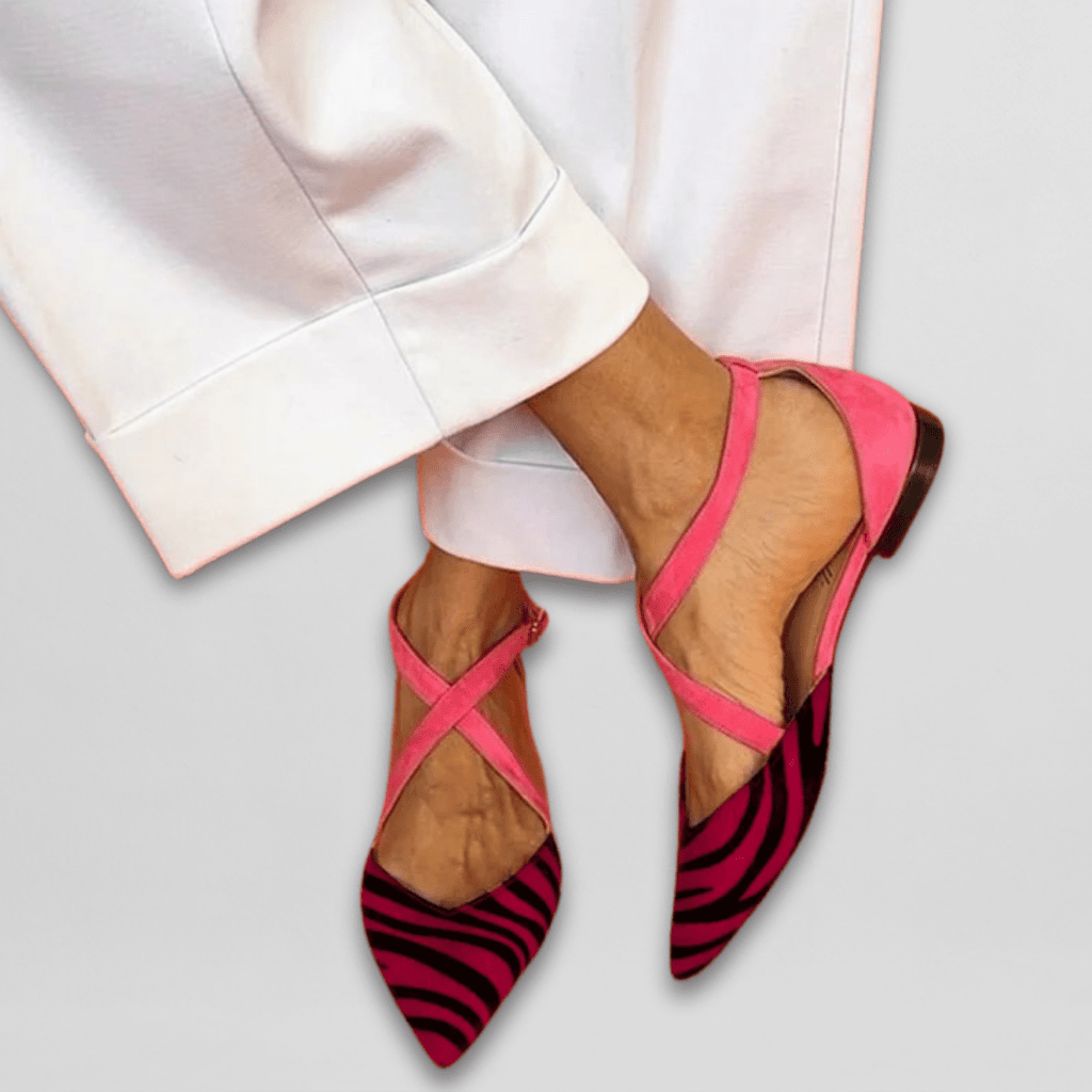 Women's pointed-toe ballet flats with cross-over ankle straps and striped toes