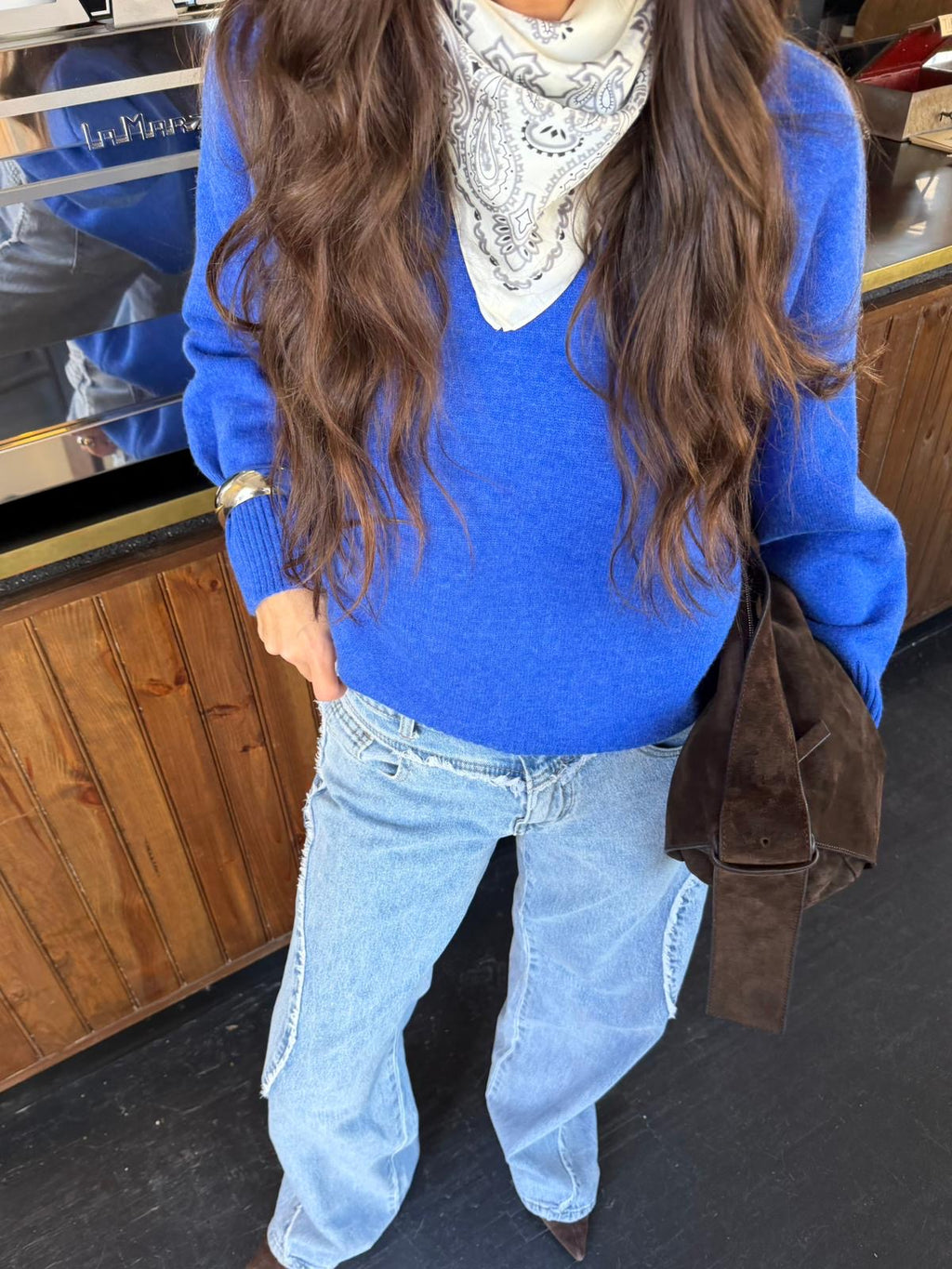 Women's royal blue V-neck sweater with long sleeves and ribbed trims
