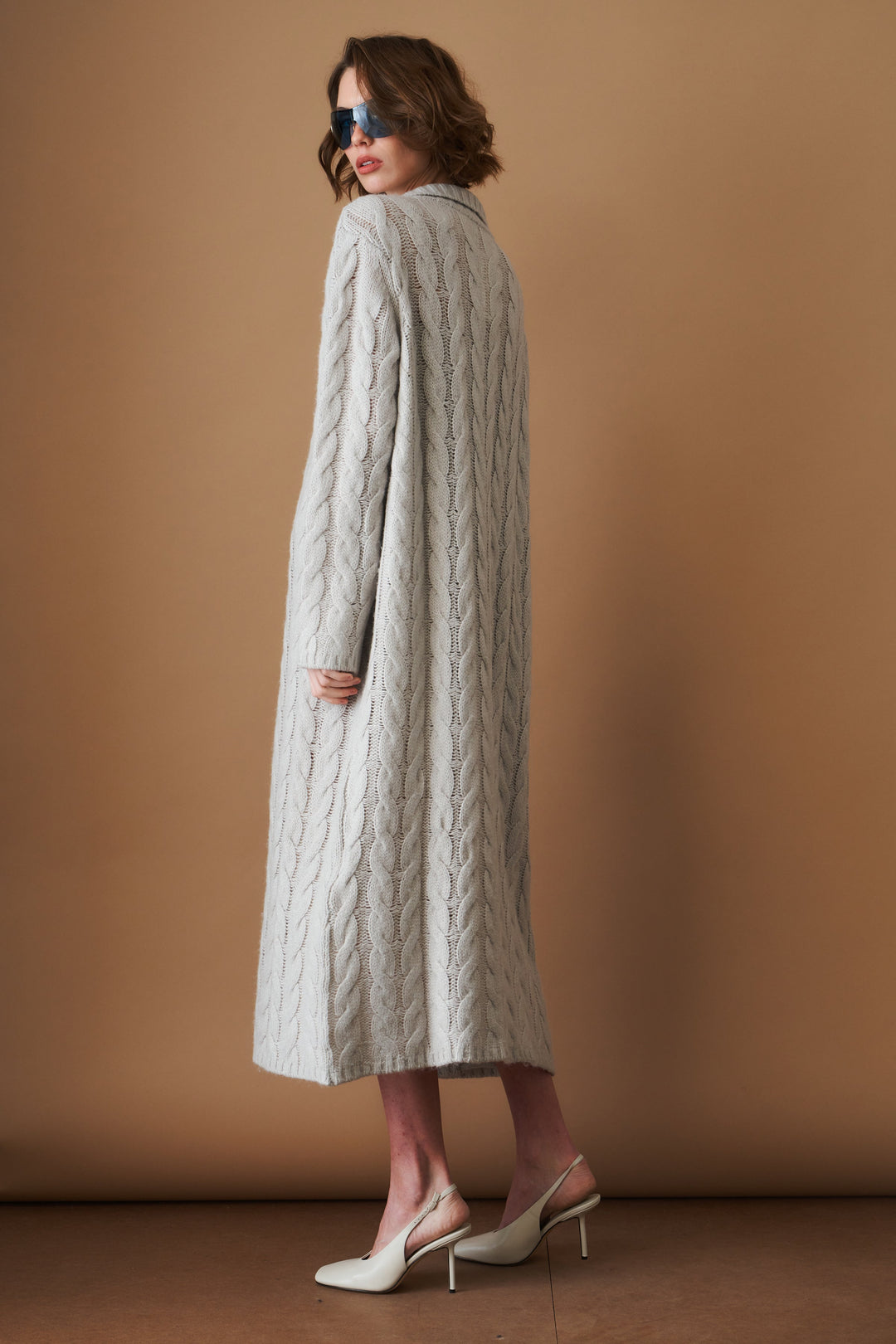 Women's light grey long cable knit cardigan with buttons and wide collar
