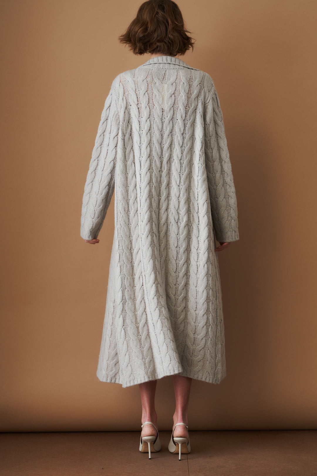Women's light grey long cable knit cardigan with buttons and wide collar