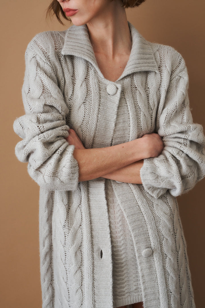 Women's light grey long cable knit cardigan with buttons and wide collar
