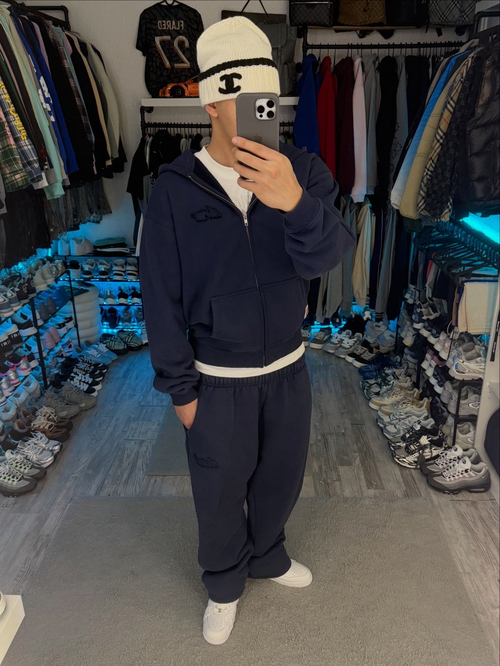 Navy zip-up hoodie with hood, long sleeves and front pouch pockets