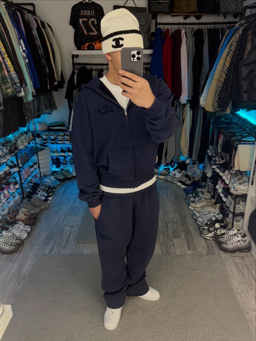 Navy zip-up hoodie with hood, long sleeves and front pouch pockets
