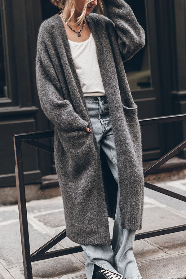 Women's oversized open front knit midi cardigan with long sleeves and front pockets