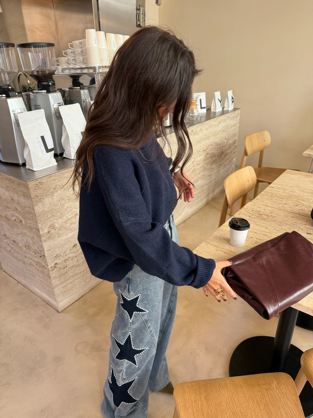 Women's light blue wide leg jeans with studded star leg details