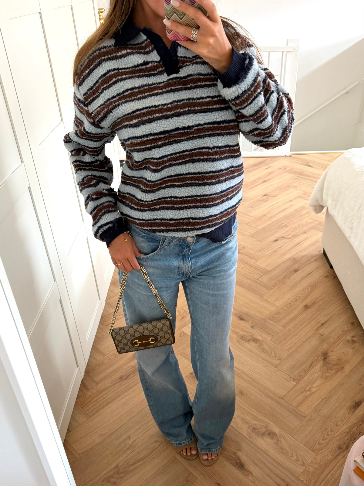 Women's textured striped sweater with collared V-neck and long sleeves
