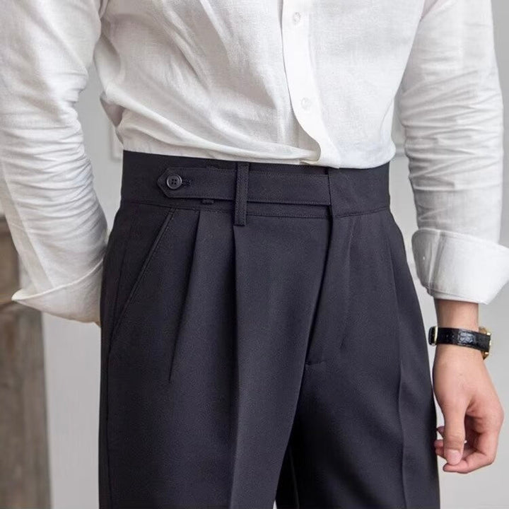 Women's high-waisted pleated straight-leg trousers shown in beige and black