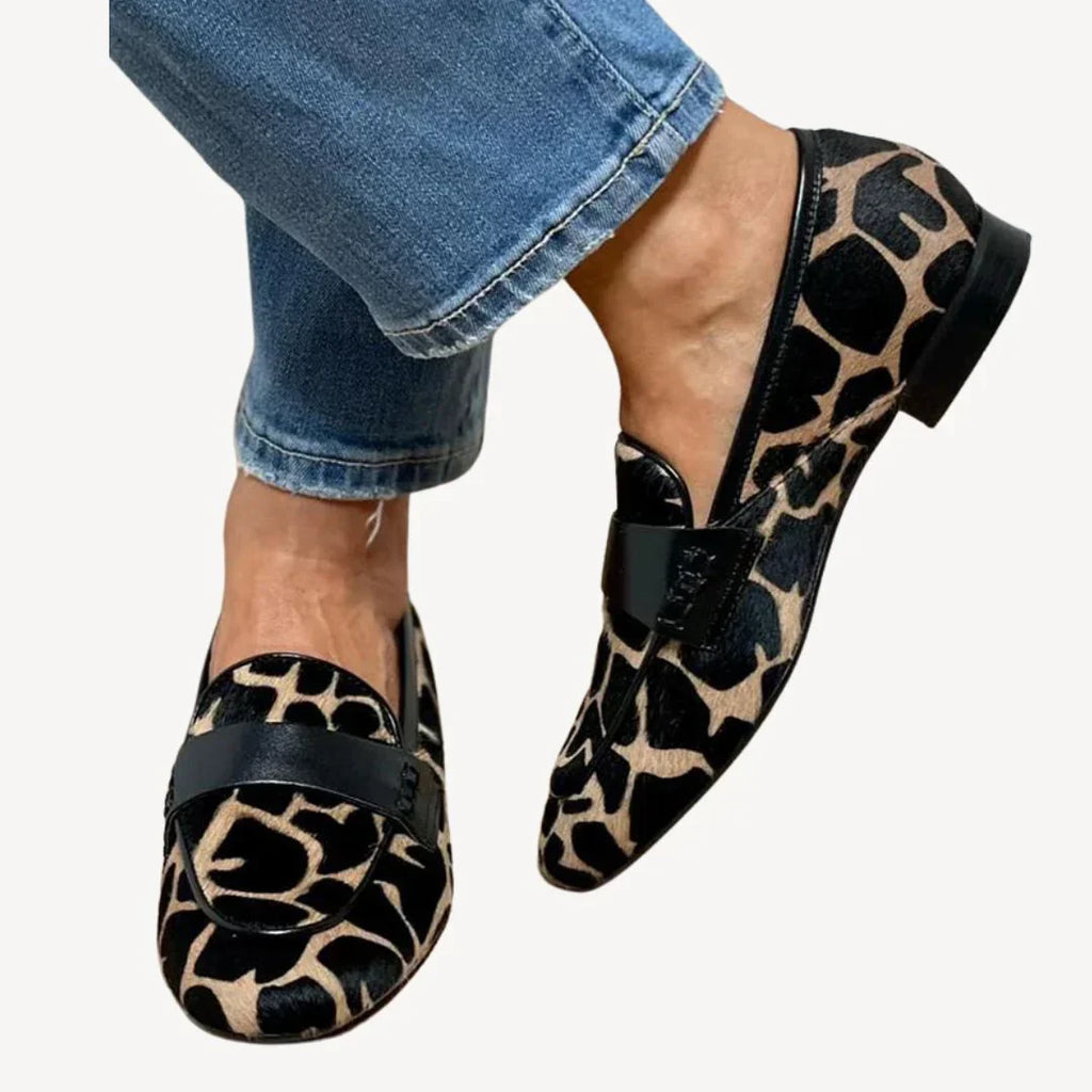Women's leopard print loafers with black vamp strap