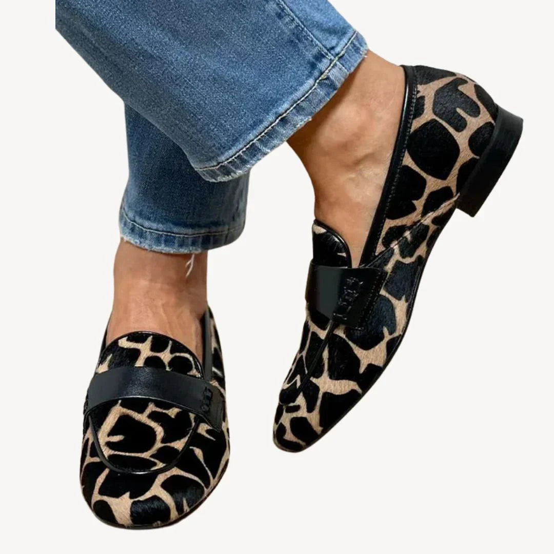 Women's leopard print loafers with black vamp strap