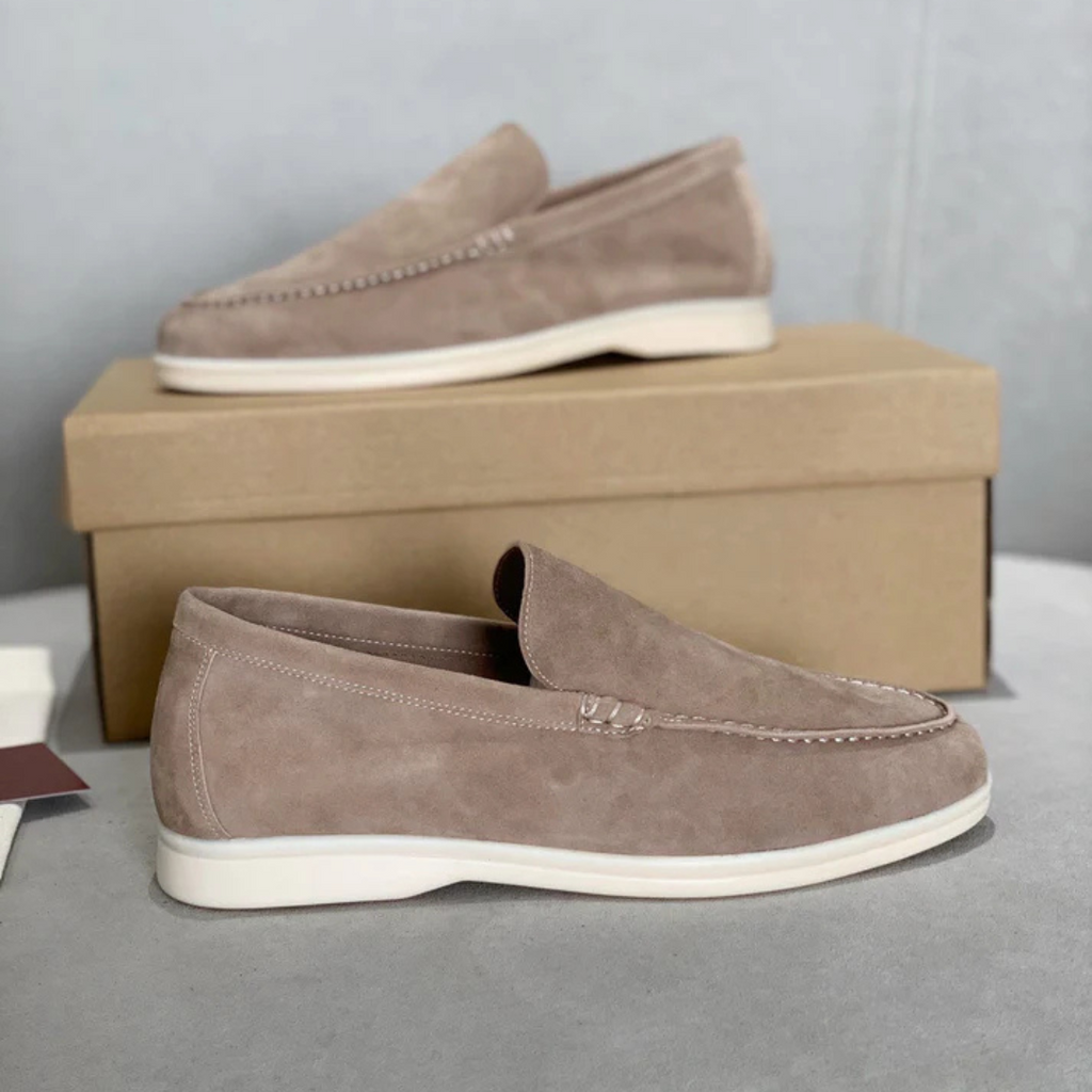 Men's slip-on loafers with textured uppers, moc toe stitching and white flat soles