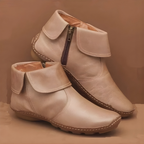 Ankle boots with foldover cuffs, side zips and textured soles