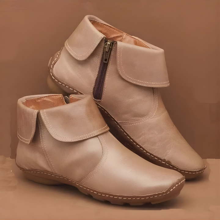 Ankle boots with foldover cuffs, side zips and textured soles
