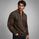 Men's patterned half-zip sweater with mock neck and brown elbow patches