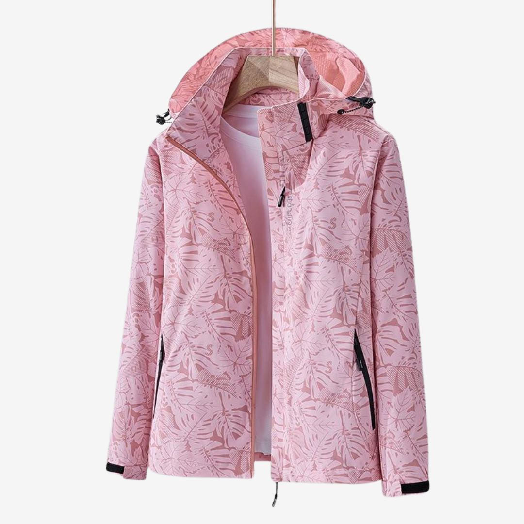 Women's hooded leaf print windbreaker jacket with long sleeves and zipped pockets