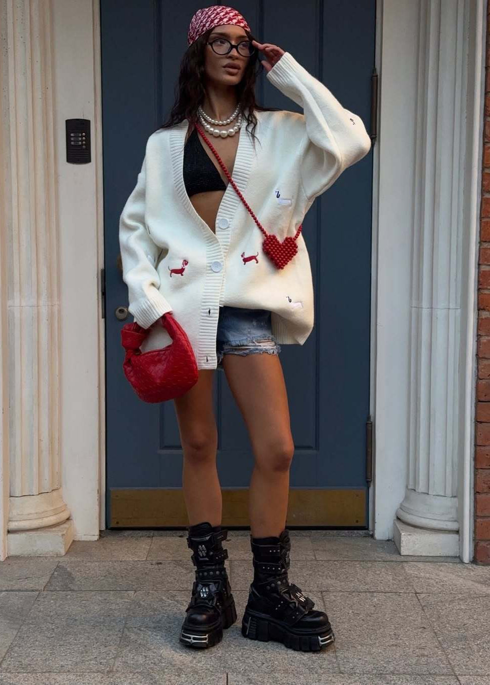 Women's oversized cable knit cardigan with buttons and embroidered motifs