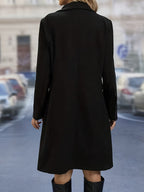 Women's double-breasted mid-length trench coat with notched collar and flap pockets