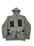 Men's grey zip-up hoodie with hood, graphic patches and front pockets