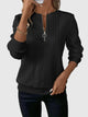 Women's textured quarter-zip sweater with long sleeves and ribbed trims