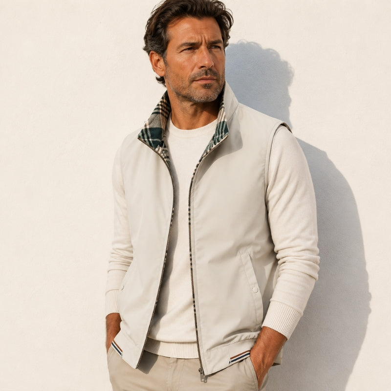 Men's sleeveless zip vest with stand collar, angled zipped pockets and checked lining
