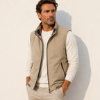 Men's sleeveless zip vest with stand collar, angled zipped pockets and checked lining