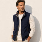Men's sleeveless zip vest with stand collar, angled zipped pockets and checked lining