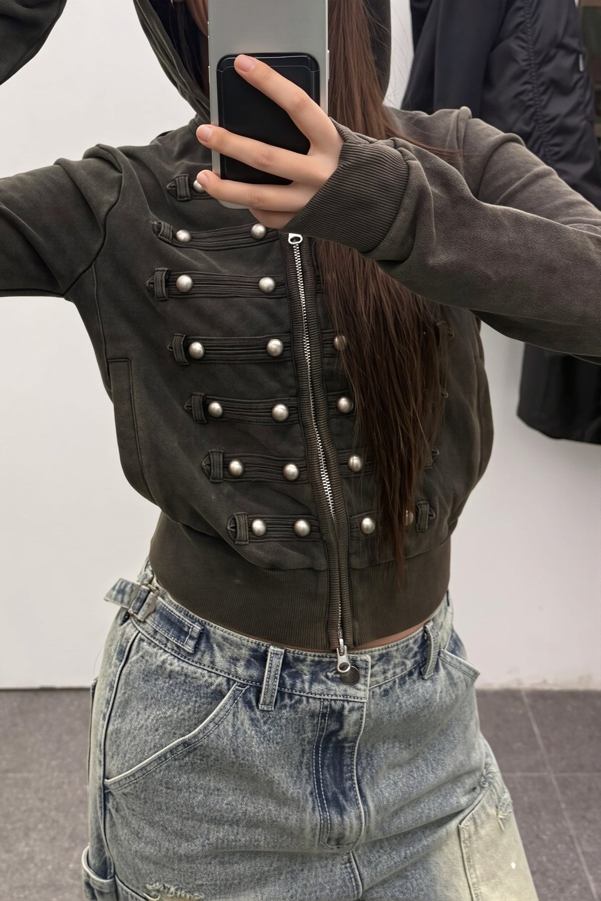 Women's black fitted hoodie with studded front trims and zip fastening