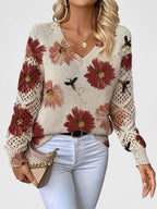 Women's floral V-neck sweater with long sleeves and open-knit sleeve panels