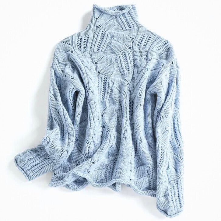 Women's cable knit turtleneck jumper with long sleeves and raised textured pattern