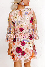 Women's pink floral mini dress with round neckline and 3/4 sleeves