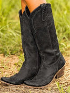 Women's studded knee-high cowboy boots with pointed toes