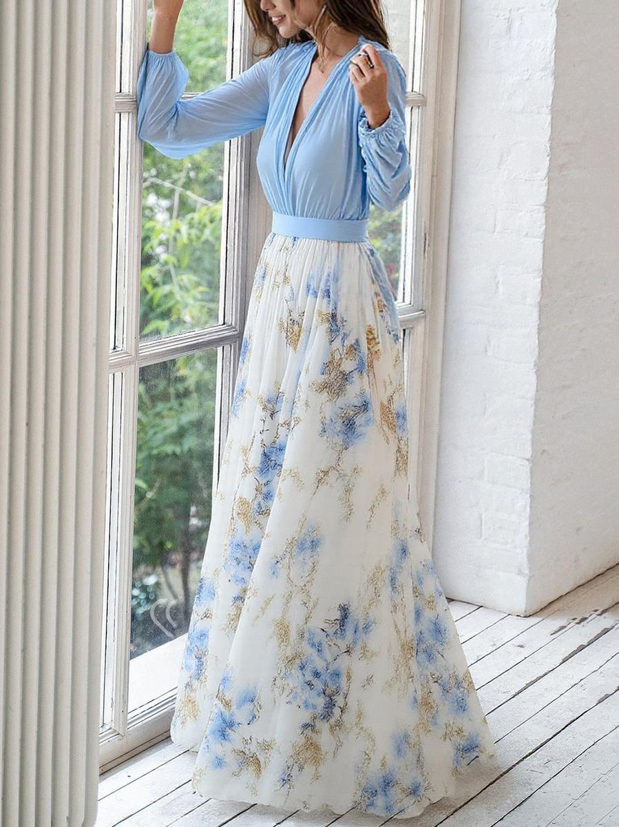 Women's floral maxi dress with blue long sleeves and flowing printed skirt