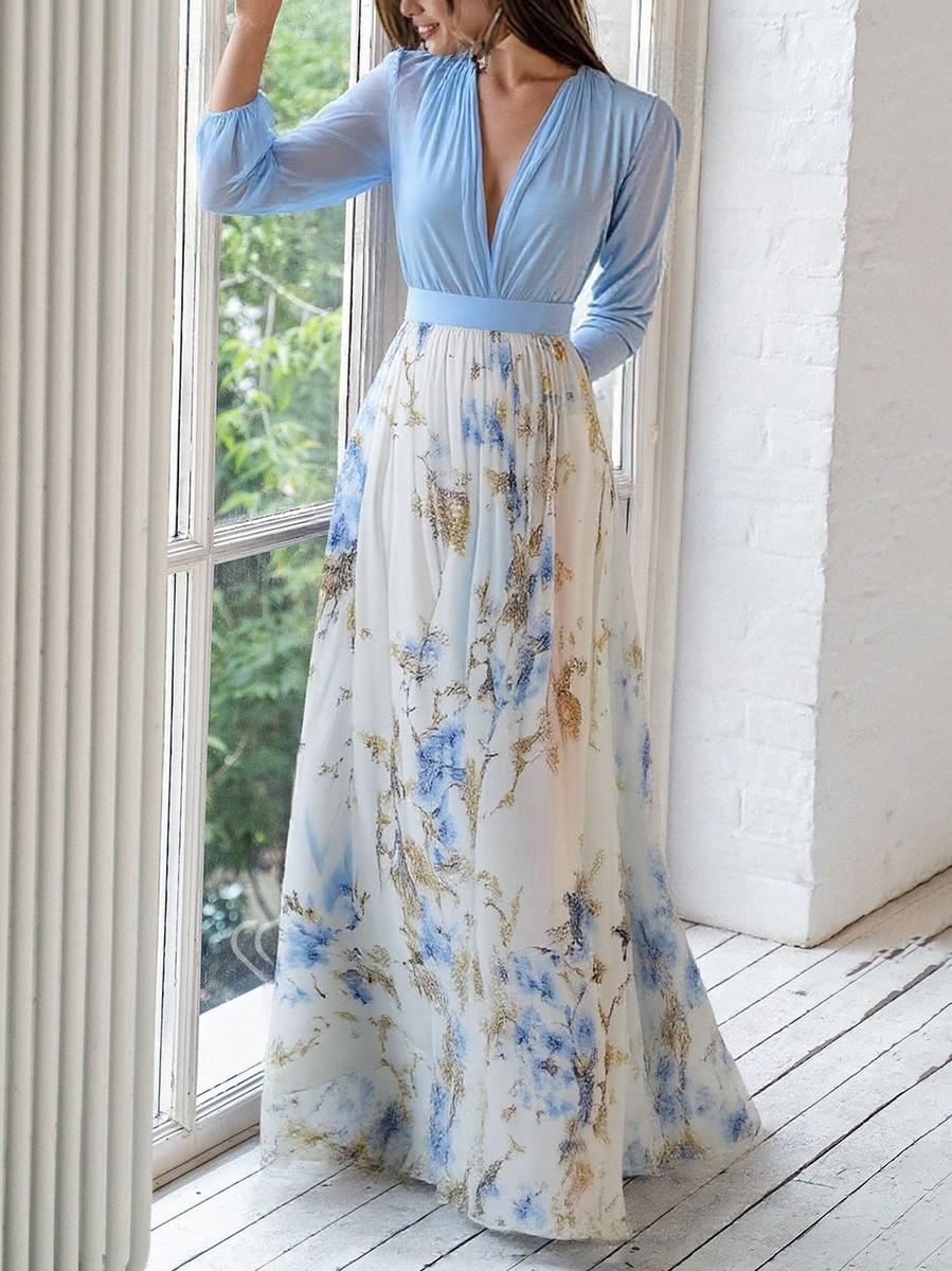 Women's floral maxi dress with blue long sleeves and flowing printed skirt