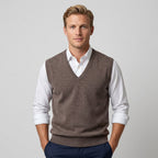 Men's sleeveless V-neck jumper layered over a collared shirt