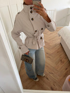 Women's beige cropped trench jacket with stand collar and tie belt