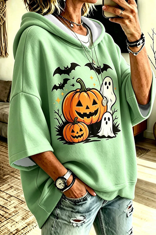 Women's oversized hooded top with pumpkin, bat and ghost Halloween graphic