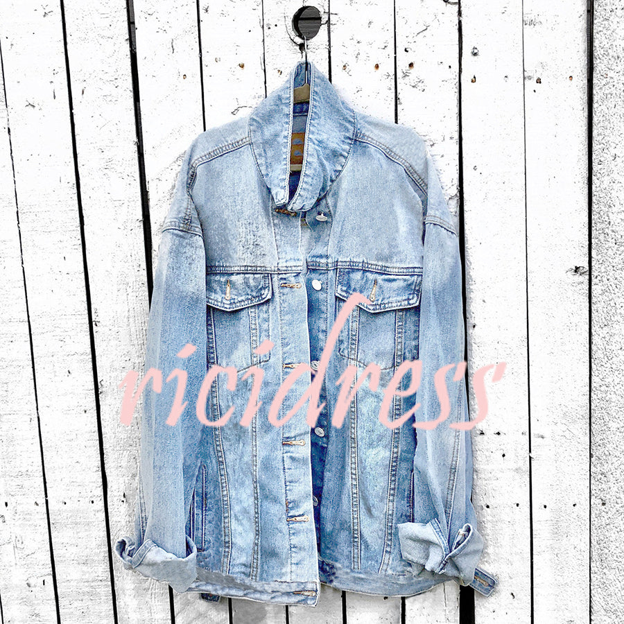 Graphic denim jacket with colourful Halloween-style artwork on the back