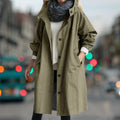 Women's longline hooded rain coat with button front and side pockets