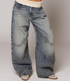 Women's washed blue wide-leg jeans with contrasting curved panel detailing