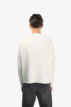Men's off-white crew neck knit sweater with long sleeves