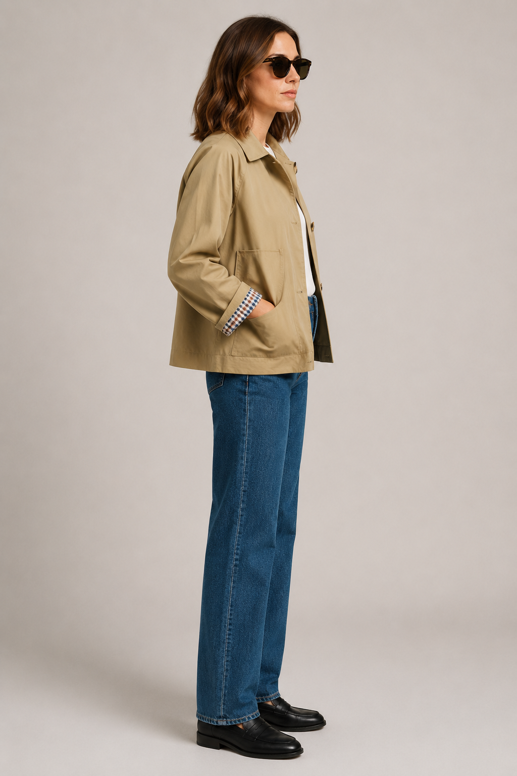 Women's beige short trench jacket with button front and checked turn-back cuffs