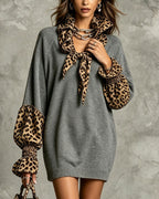 Women's grey sweater mini dress with leopard print scarf collar and cuffs