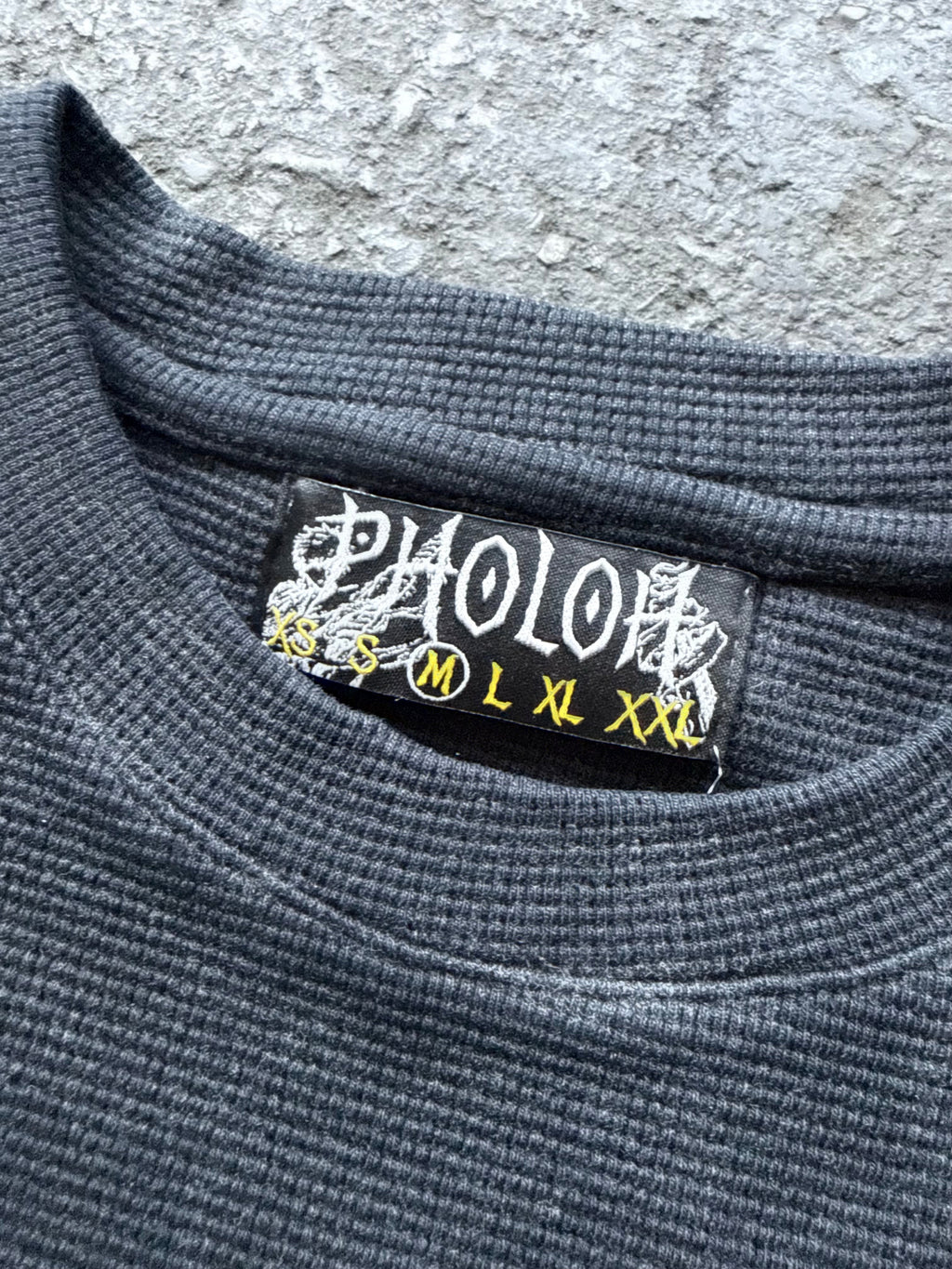 Women's black crewneck sweatshirt with monochrome graphic front print
