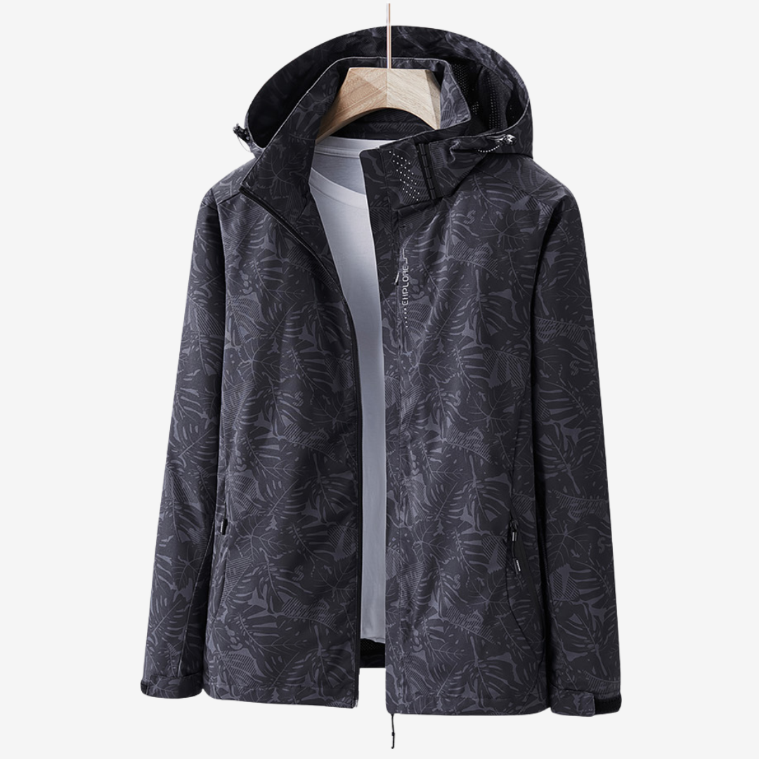 Women's hooded leaf print windbreaker jacket with long sleeves and zipped pockets