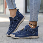 High-top sneakers with lace-up front and stitched panels