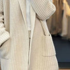 Women's textured open front longline cardigan with long sleeves and patch pockets