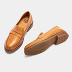 Men's penny loafers with rounded toes, stitched trim and low heels