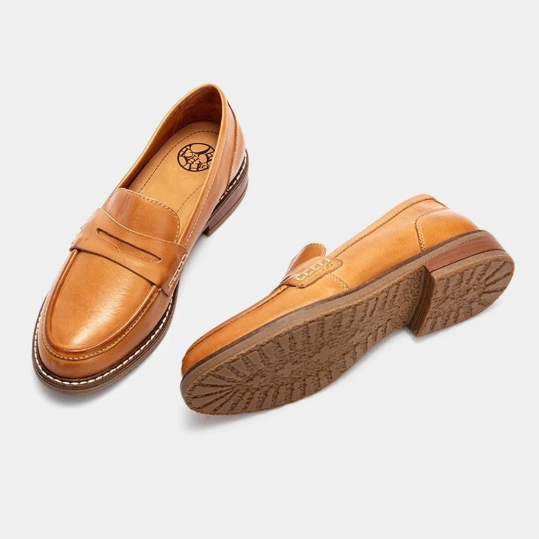 Men's penny loafers with rounded toes, stitched trim and low heels