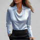 Women's long-sleeve blouse with draped neckline and pointed collar