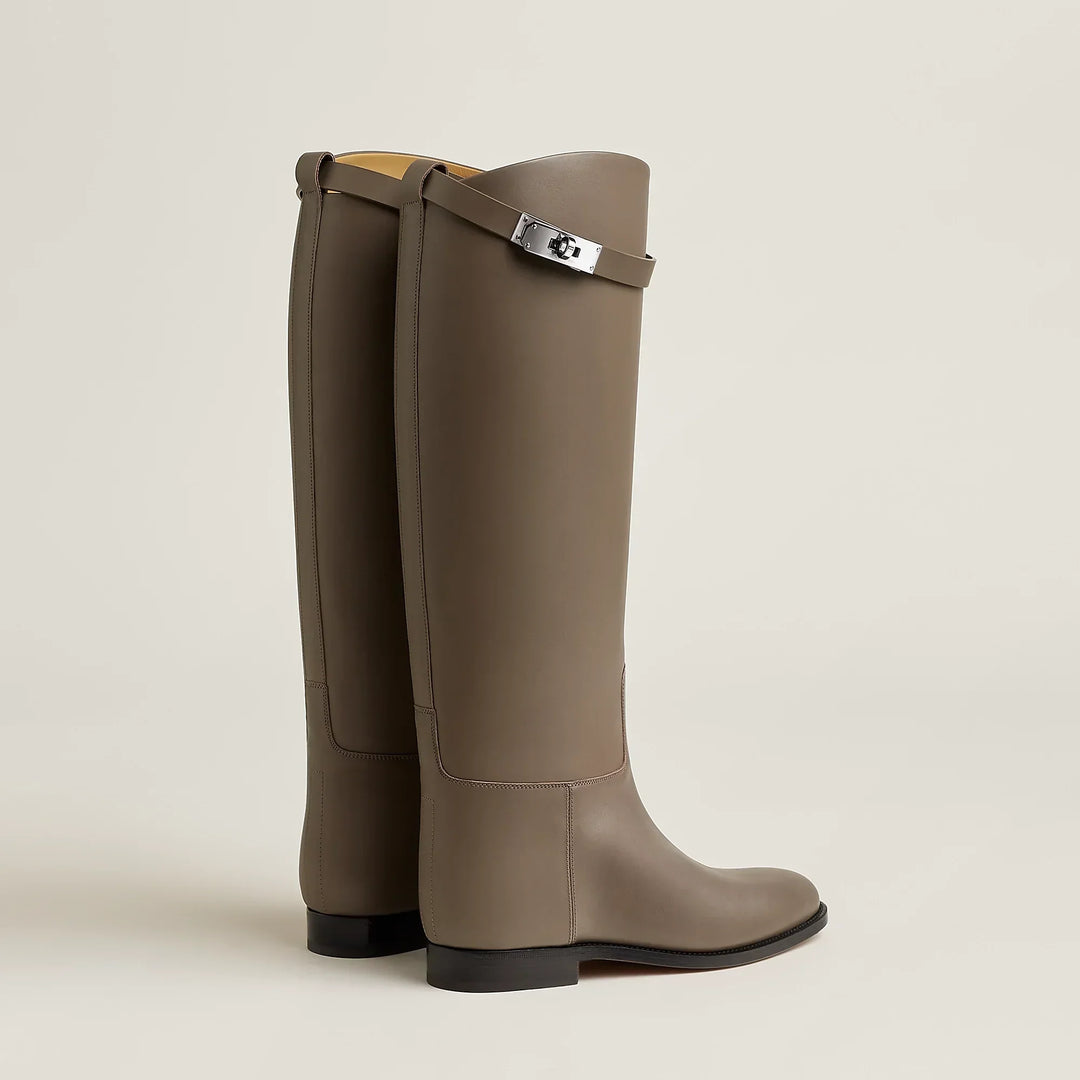 Women's tall riding boots with low heels, round toes and strap detailing